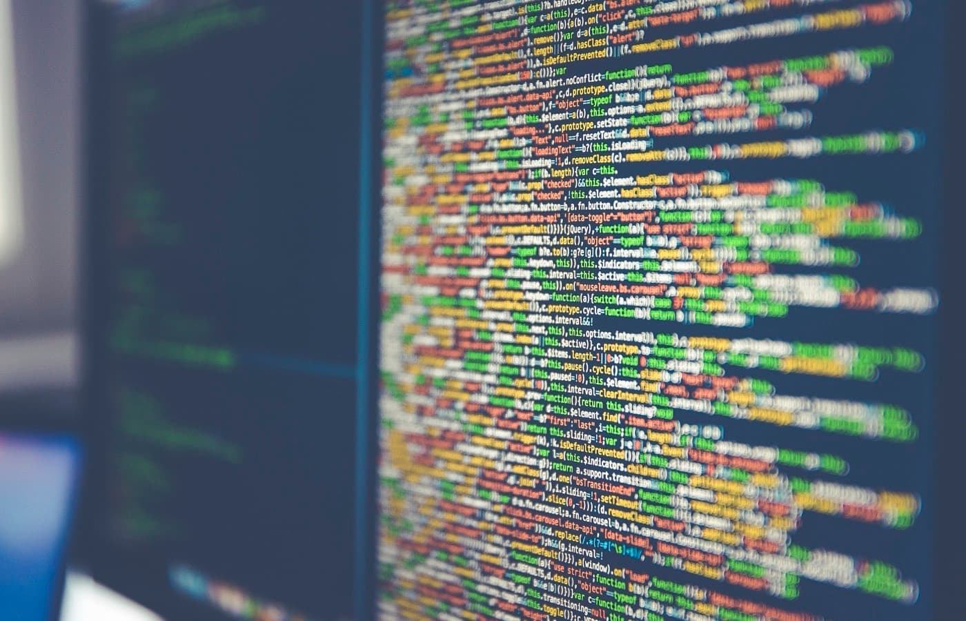 A close view of code on a monitor, the individual pixels of the text visible.