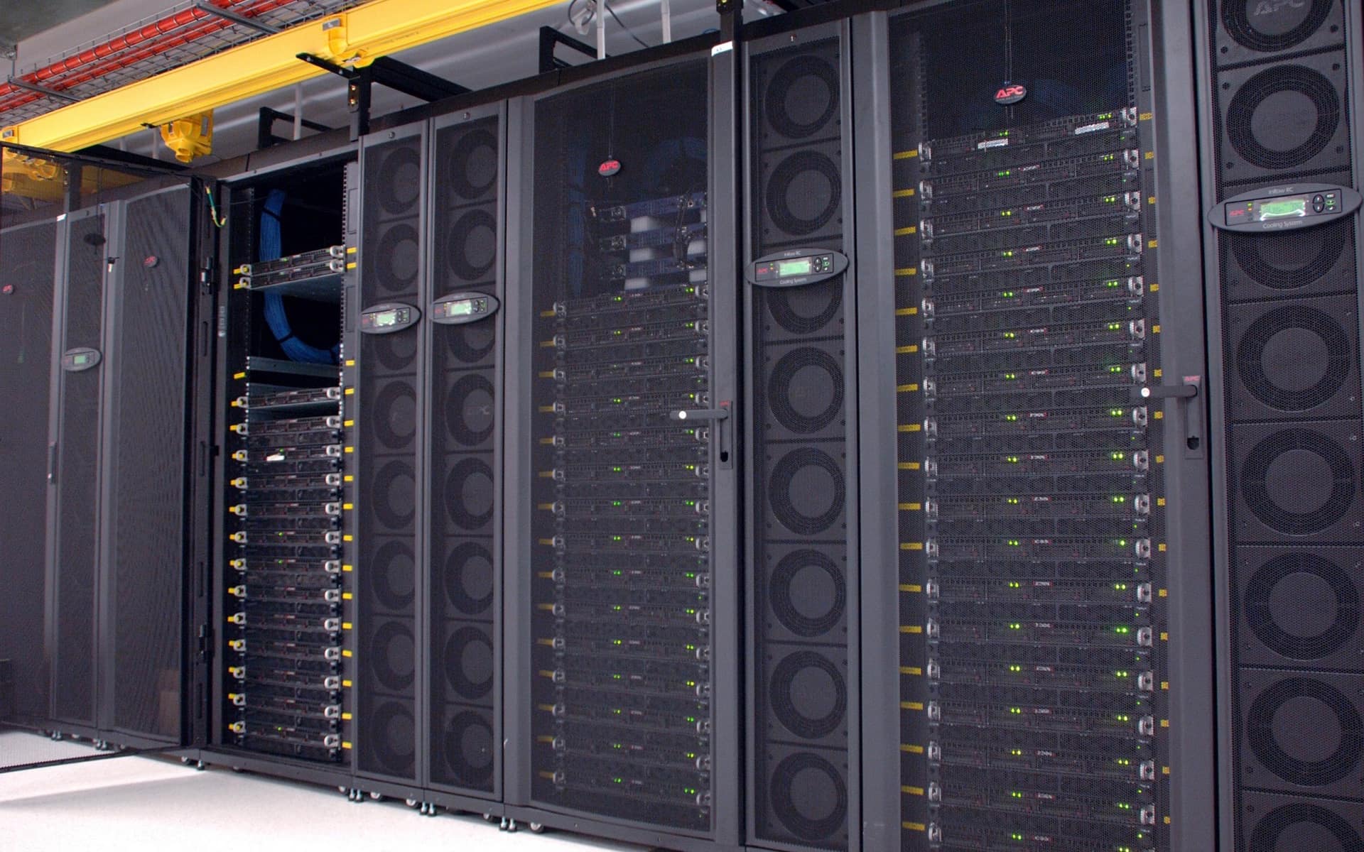 A rack of accelerator nodes in a data centre, status lights running the height of every cabinet.