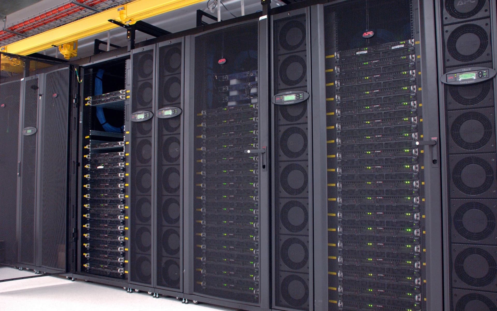 A rack of accelerator nodes in a data centre, status lights running the height of every cabinet.
